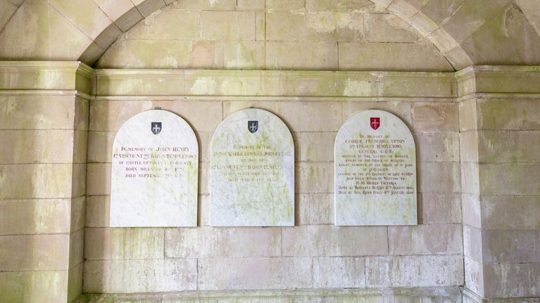 Memorial plaques of grey veined marble inside Templetown Mausoleum, Northern Ireland